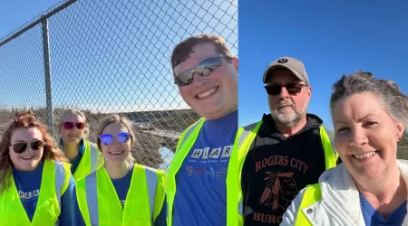 AAACU Team members taking a selfie as they clean up trash in their community